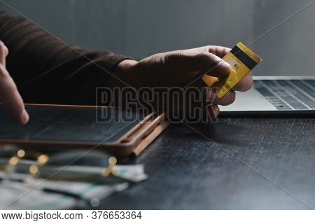 Man Typing Cvv Number For Paying With Credit Card On Tablet At Home Office Shopping, Banking, Home A
