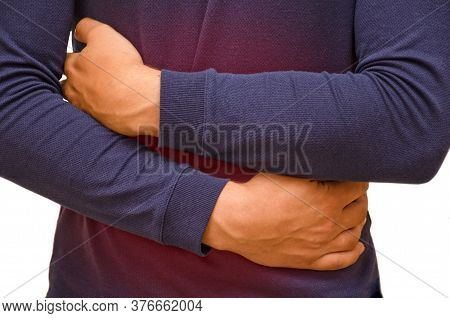 A Man Holds His Stomach Because He Has Diarrhea. Red Spot At The Site Of Abdominal Pain, Upset Stoma