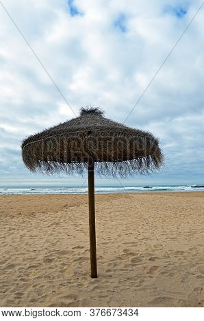 Sunshade On The Beach In Odeceixe On The Atlantic Coast Of Portugal