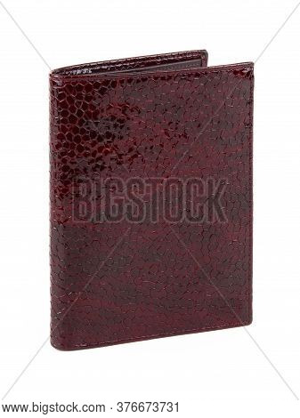 New Dark Red Wallet Of Genuine Reptile Skin Leather. Without Shadows. Isolated On White 
Background.