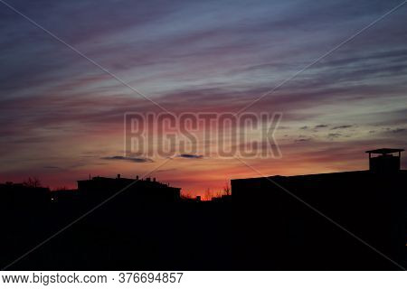 Silhouette Of Buildings With Pinkish Red Twilight Sky In The Background Captured In Kiruna, Sweden