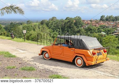 Jatiluwih, Bali, Indonesia : March 30, 2020. An Orange Volkswagen Thing 181 With Black Canvas Roof A