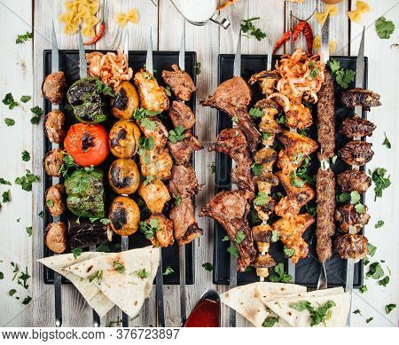 Top View On Assorted Caucasian Skewers Shashlyq Set With Meat And Vegetables
