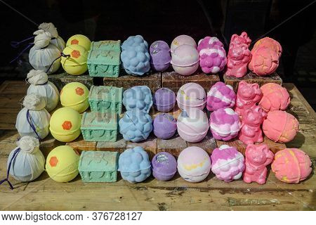 Mixed Colored Aromatic Bath Bombs In Display For Sale In An Window Store, In Soft Focus