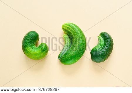 Trendy Ugly Vegetables. Fresh Ugly Cucumbers On A Beige Background. Imperfect Food Non-standard, Fun