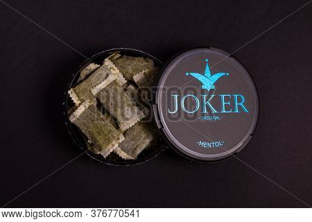 Swedish Snus, An Open Can Of Snuff On A Black Background, Snus Is Addictive. Moscow Russia November 