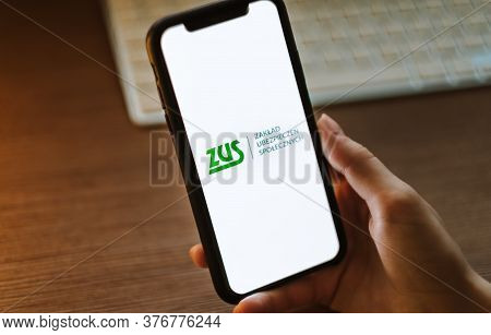 Zus Logo On The Smartphone Screen In Hand. High Quality Photo