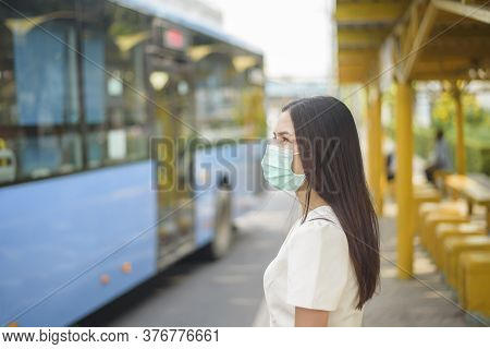 Beautiful Woman Is Wearing Face Mask In Bus Stop