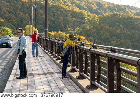 Aomori Prefecture, Japan - Oct 17, 2019 : Tourists Sightseeing On The Jogakura Ohashi Bridge During 