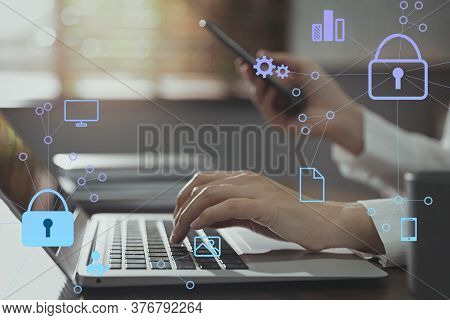 Information Security. Young Woman Using Laptop At Table Indoors, Closeup