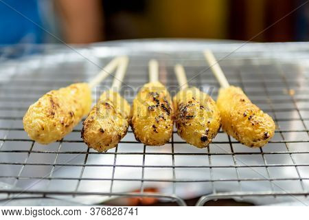 Omelette Rice Or Snacks Grill With Charcoal Stove Is Local Food Of Northern Thailand In Night Market