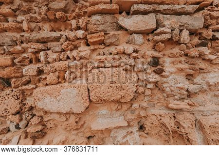 Stone Wall Texture/background,historical Old Ancient Stone,preserved To Our Time, Stones Are Laid Ev