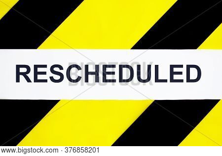 Rescheduled Text On Tape Black And Yellow Background