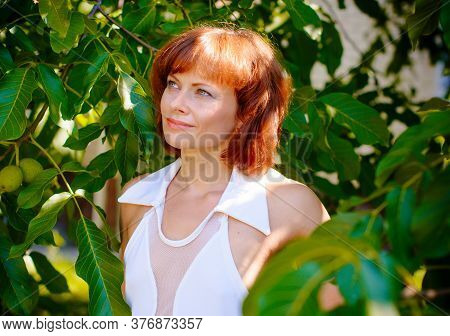 Miniature Mature Woman Resting On Nature And Enjoying Weekend. The Concept Of Harmony With Life And 
