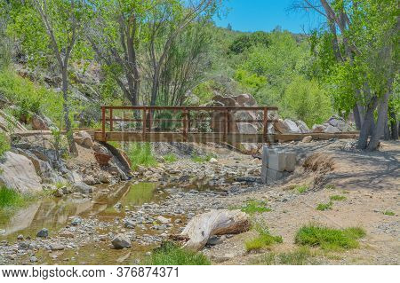 A Bridge Spans A Finger Cove On Fain Lake.