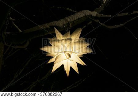 Beautiful Paper Lanterns In Shape Of Stars As Christmas Decorative Elements Lightning On Black Backg