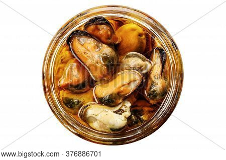 Canned Mussels In A Jar On A White Background, Isolated. View From Above