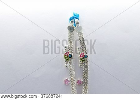 Beautiful Silver Leg Chain With Flower Design On The White Background (anklet)
