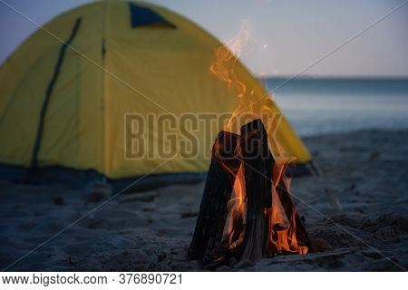 Fire In Bonfire In The Beach . Camping And Tents To Travel