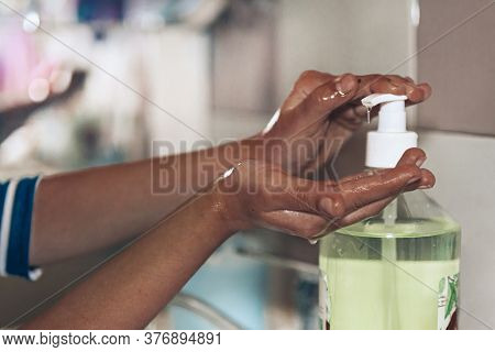 Washing Of Hands With Soap Under Running Water. An African-american Baby Girl Washes Her Hands. Pres