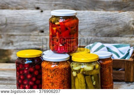Jars With Variety Of Canned Vegetables And Fruits, Jars With Zacusca. Preserved Food Concept In A Ru