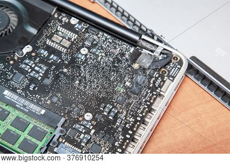 Oppened Laptop With Circuit Board On The Table For Repair, Fixing Or Upgrade. Topv View