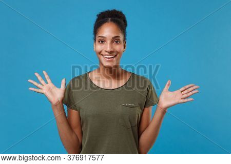 Excited Young African American Woman Girl In Casual T-shirt Posing Isolated On Bright Blue Backgroun