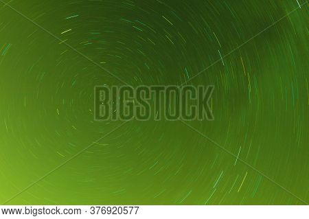 Background Of Round Or Circular Star Track Or Trajectory On The Green Clear Night Sky. Symbol Of Spa