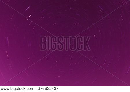 Background Of Round Or Circular Star Track Or Trajectory On The Red, Pink Or Rose Clear Night Sky. S