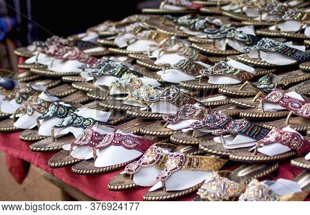 Display Of Indian Ethnic Shoes For Women At A Flea Market In Goa, India