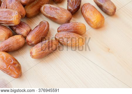 Group Of Dried Sweet Deglet Nour Date Fruites On Wooden Table.organic Vegetarian Food