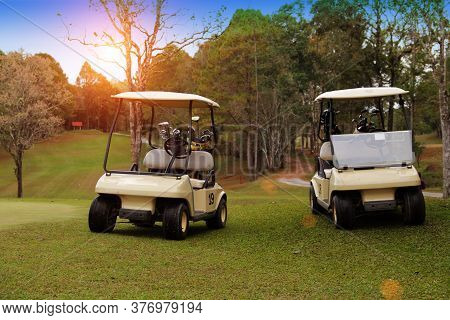 Golfcar In Beautiful Golf Course In The Evening Golf Course With Sunshine In Thailand