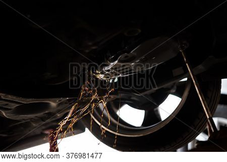 Car Mechanic Drain Automatic Transmission Fluid