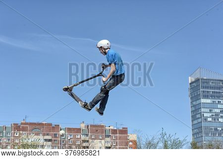 Russia, St. Petersburg, 10,05,2015.boy On Scooter Flips In The Air, The Youth Festival Of Extreme Sp