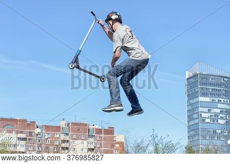 Russia, St. Petersburg, 10,05,2015.boy On Scooter Flips In The Air, The Youth Festival Of Extreme Sp