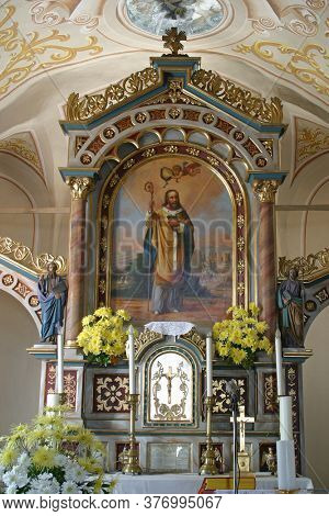 HRNETIC, CROATIA - JULY 15, 2012: Saint Martin, main altar in the Saint Martin's Parish Church in Hrnetic, Karlovac, Croatia