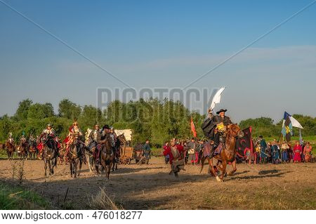 Gniew, Poland, Aug 2020 Horseman Runs Away With White Flag From Polish Hussars. Historical Reenactme