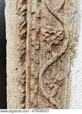 Stone Lace And Flowers On Ancient Building