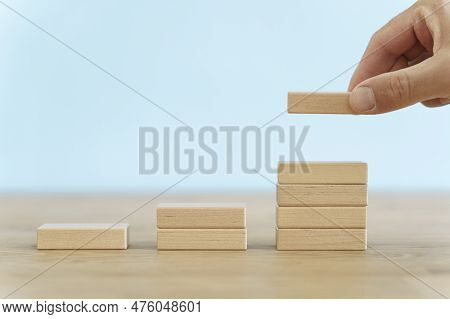 Growth, Target, Upskill Concept. Growth Of Wooden Cubes On A Clean Background. Business, Economics, 