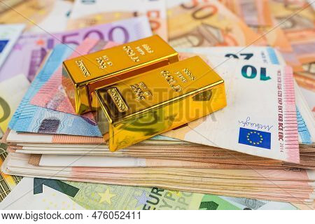 Euro Banknotes And Gold Bars. Gold Bars On Money