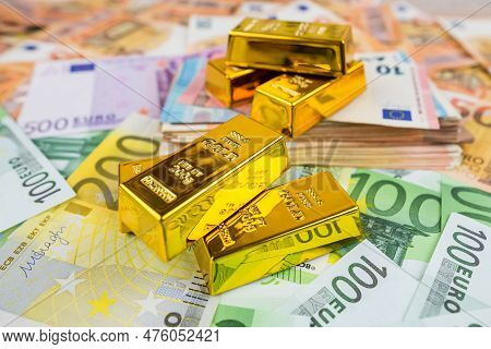 Euro Banknotes And Gold Bars. Gold Bars On Money