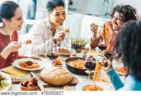 Cheerful Young People Having Lunch Break And Lauthing Together