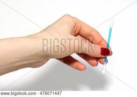 Female  Hand Holding Q-tip With Plastic Stick