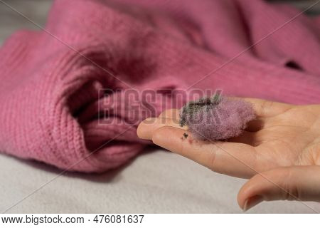 Woman Using Anti-pilling Razor At Home. Device For Shaving Clothes. Anti-plush Fabric Shaver. Electr