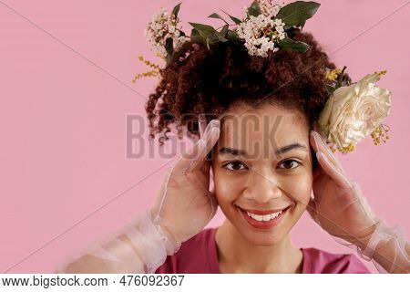 Close Up Of Happy Young Smiling Female African Ethnicity In Pink Clothes, Transparent Gloves And Flo