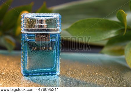 Poland, Warsaw - May 10, 2023: Perfume, Versace For Men. A Bottle Of Versace Men's Perfume On A Blue