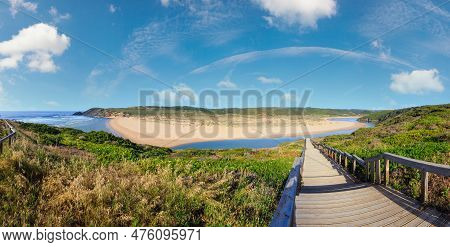 Atlantic Ocean Coast, Wooden Walkway To Amoreira Beach And Aljezur River Summer View, Algarve Region