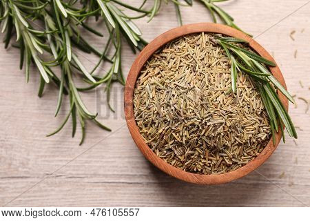 Bowl With Dry And Fresh Rosemary On White Wooden Table, Flay Lay. Space For Text