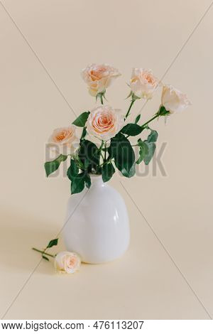 Tender Rose Flowers In A Vase On A Pink Pech Pastel Background. Place For Text.