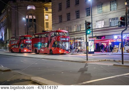 London - April 21, 2023: Experience The Iconic Transportation System Of London With Two Red Double D
